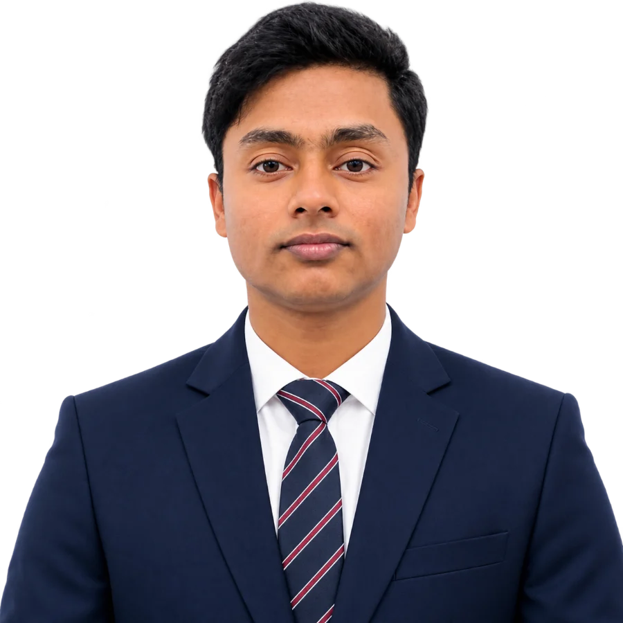 Uddin Sahab wearing a navy suit